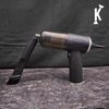 Handheld vacuum cleaner with attachments on a dark surface