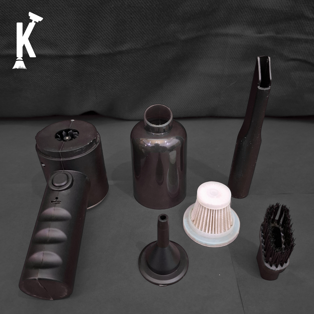 Mini Vacuum Cleaner parts: including a handheld device, bottle, nozzle, brush, and funnel on a dark background.